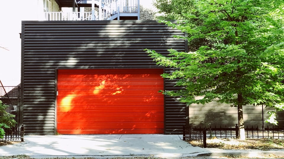 red-garage-door-grey-building
